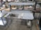 stainless table w/ backsplash & overshelf, space for poly
