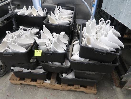 pallet of plastic tubs filled with gravy/dressing boats