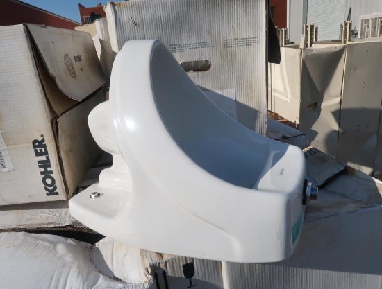 pallet of Kohler urinals, new
