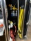 GROUP OF CLEANING SUPPLIES AND RED HOSE