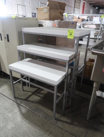 cascading merchandising tables w/ solid surface tops