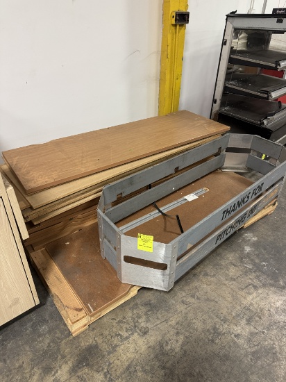 Pallet of wooden panels and wooden trash can frame