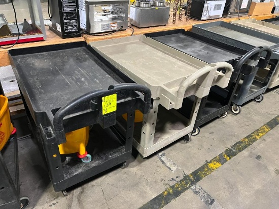 plastic stocking carts, 2) w/ mop buckets on them