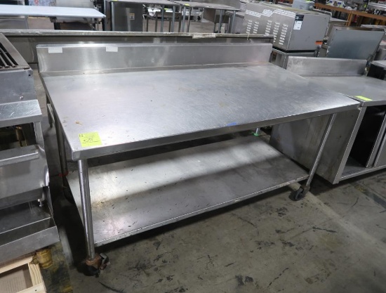 stainless table w/ backsplash & undershelf, on casters