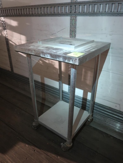stainless table w/ top constraint, undershelf, & casters