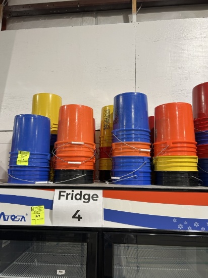 GROUP OF PLASTIC BUCKETS ON COOLER