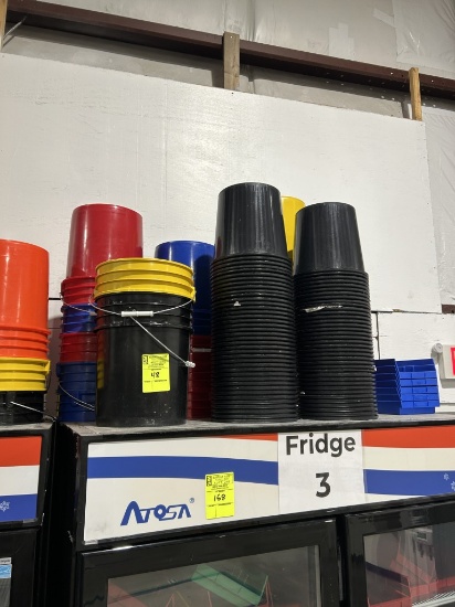 GROUP OF PLASTIC BUCKETS ON COOLER