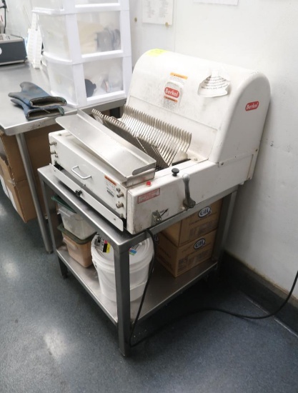 Berkel bread slicer on stainless table