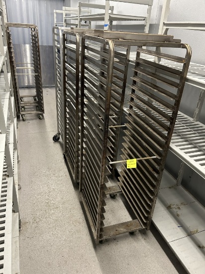 (4) OVEN RACKS AND (1) ALUMINUM SHEET PAN RACK