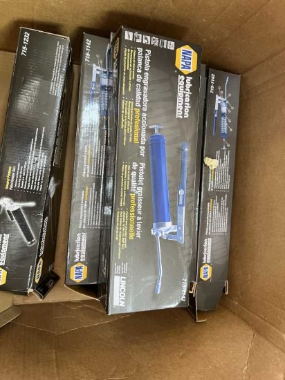 Box of Grease Guns