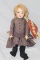 APPROX 21 IN AM 560A, HUMAN HAIR & ANTIQUE CLOTHES