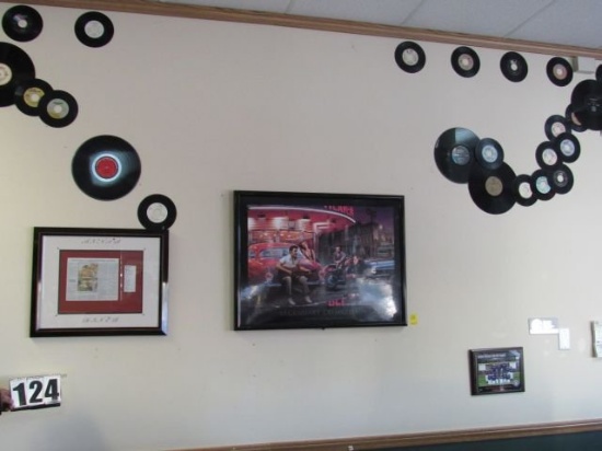 wall of Elvis Memorabilia pictures, records