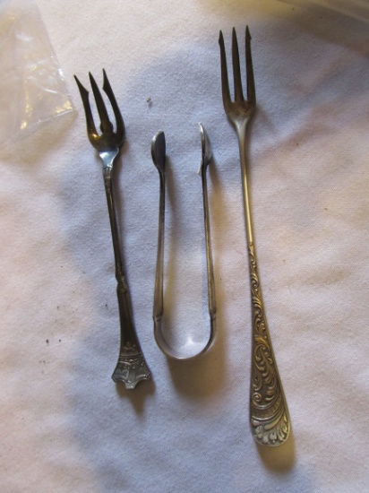 Group of 3 - silver Regal 1880 Rogers cocktail fork, silver sugar tongs & 1910 silver cocktail fork