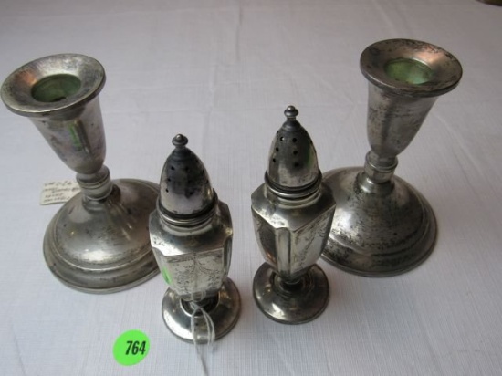 Group of sterling silver - 2 weighted candle sticks & a pair of salt & pepp