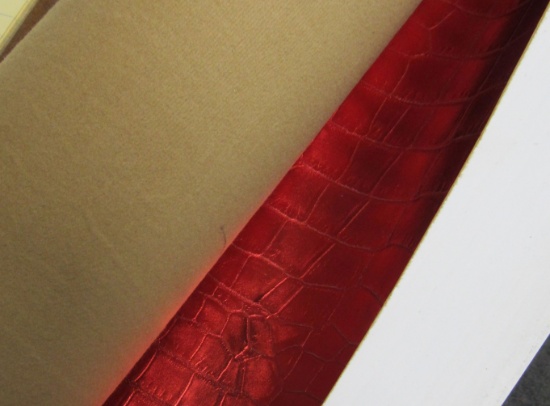 56" roll bright red upholstery vinyl shiney finish with gator hide impression total weight of roll 1