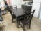 Black Dining Room Table can be expanded with leaf insert. Comes with 4 matching chairs