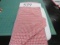 red and white checkered with daisy pattern fabric selling by the yard