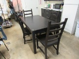Black Dining Room Table can be expanded with leaf insert. Comes with 4 matching chairs