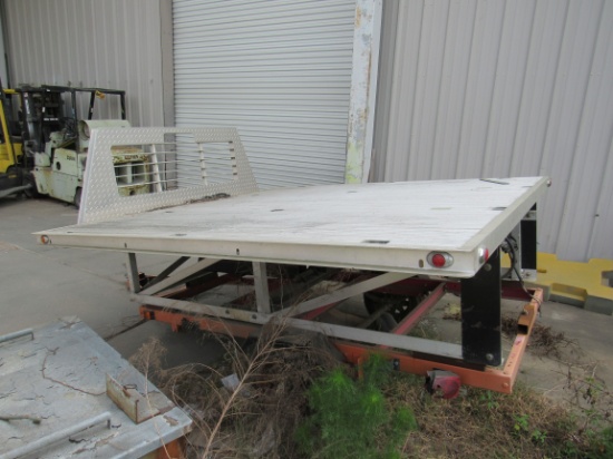 slide in pickup dump bed designed for full size long bed pickup.  Actually dumps over the top of the
