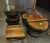 mixed lot of cast iron bowls with porcelin inside and wooden trivets (3-large bowls, 3-small bowls)