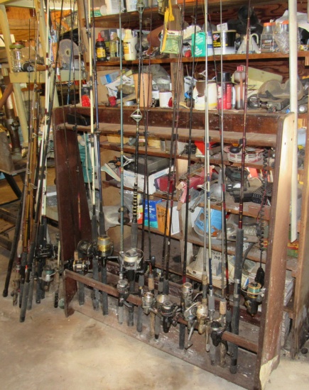 collection of salt and fresh water rods and reels with rod rack