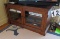 TV base cabinet with glass doors walnut finish  53