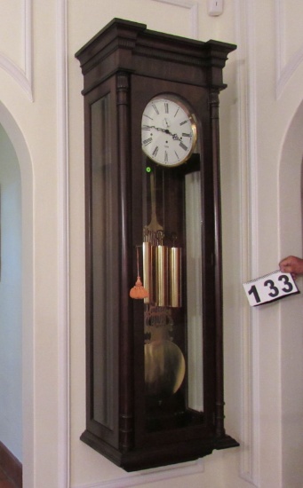 wall mounted grandfather clock made W Germany 21" w x 12" d x 68" h.  Works great chimes and keeps t