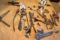 tote of mixed tools including E ring pliars, tubing benders, and cutter