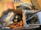 box lot of shelving brackets, door knocks, shower head, and more