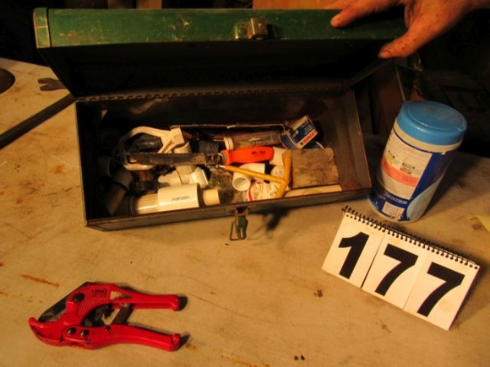 tool box with pvc fittings, cutter, and supplies