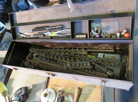 steel tool box with long wood boring bits of varying sizes