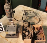 Dremel on stand with boxes die and sander ends