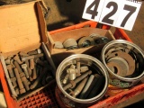 assorted large flat washers and cap screws