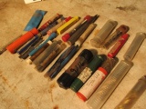 assorted size end mills in protective tubes