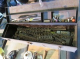 steel tool box with long wood boring bits of varying sizes