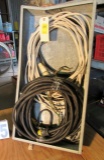 open electrical panel box with partial roll of romex and single ph heavy duty extension cord
