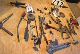 tote of mixed tools including E ring pliars, tubing benders, and cutter