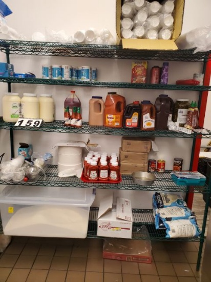 mixed condiments - ice cream mix , ketchup, Styrofoam cups & flour bin on stockroom shelf