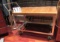 steel framed work table on casters with small vise and varnished wood top