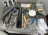 assorted jeweler's tools, clamps, sizers, pliers, rings ans polishing compound