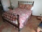 Queen Size wrought iron bed with bedding