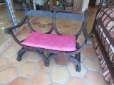ornate European walnut saddle chair