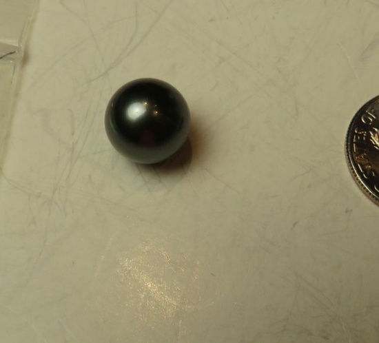 Black round Tahitian pearl approximately 11 mm