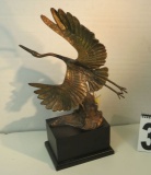 bronze Heron in flight  16