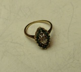 gold ring w/green stones & center diamond size 4 1/4