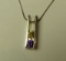 Sterling pendant w/2 c.z. (dark yellow & purple) on 16