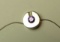 Sterling round pendant w/purple c.z. on 16