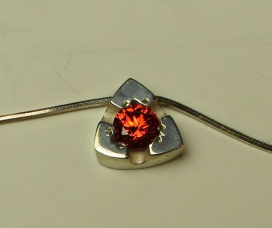 Sterling triangular pendant w/red orange c.z. on 16" sterling chain