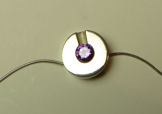 Sterling round pendant w/purple c.z. on 16" sterling chain