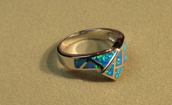 Rhodium pla. Lab created opal ring size 9, weight 6.2 g